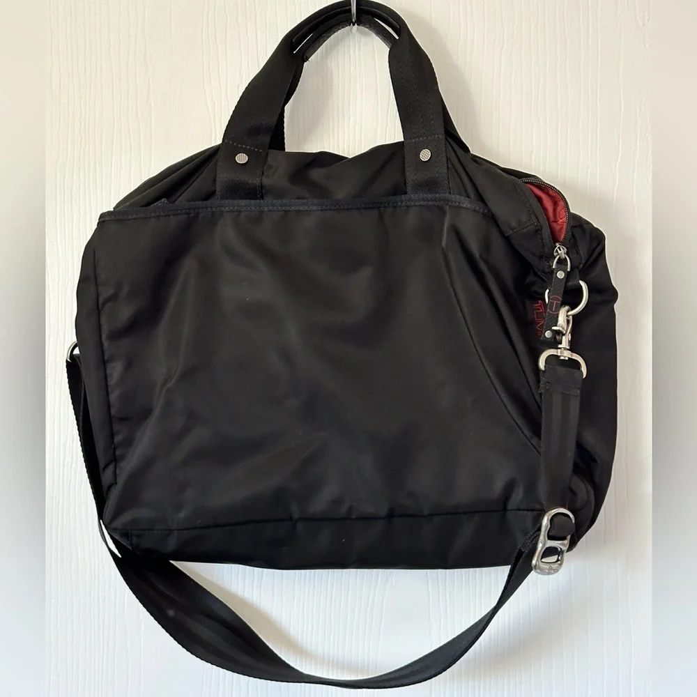 Vintage Tumi laptop/crossbody bag. Black with red lining, great find!